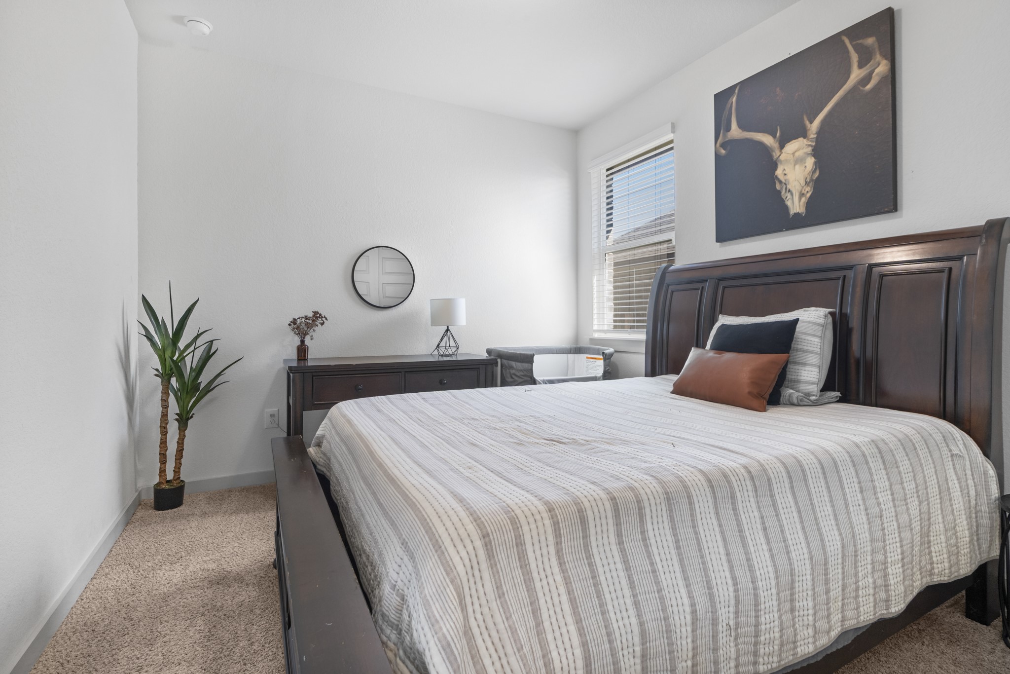620 Peace Pipe Way Georgetown, TX 78628 - Photo 6 of 32 a bedroom with a bed and window