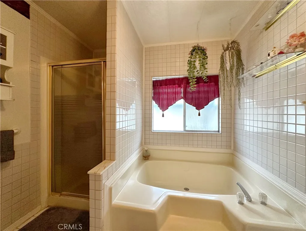 692 North Adele Street, Unit 30 Orange, CA 92867 - Photo 17 of 20 a bathroom with a tub and shower