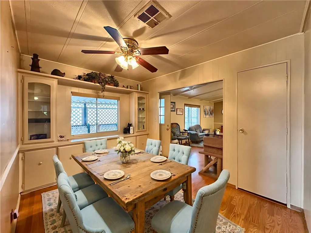 692 North Adele Street, Unit 30 Orange, CA 92867 - Photo 9 of 20 a view of a dining room with furniture and wooden floor