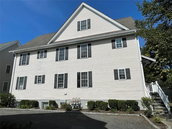 a front view of a house with garage