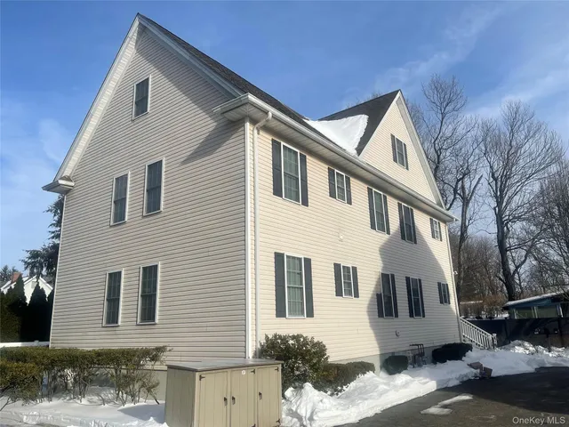 a bathroom with a shower and a sink