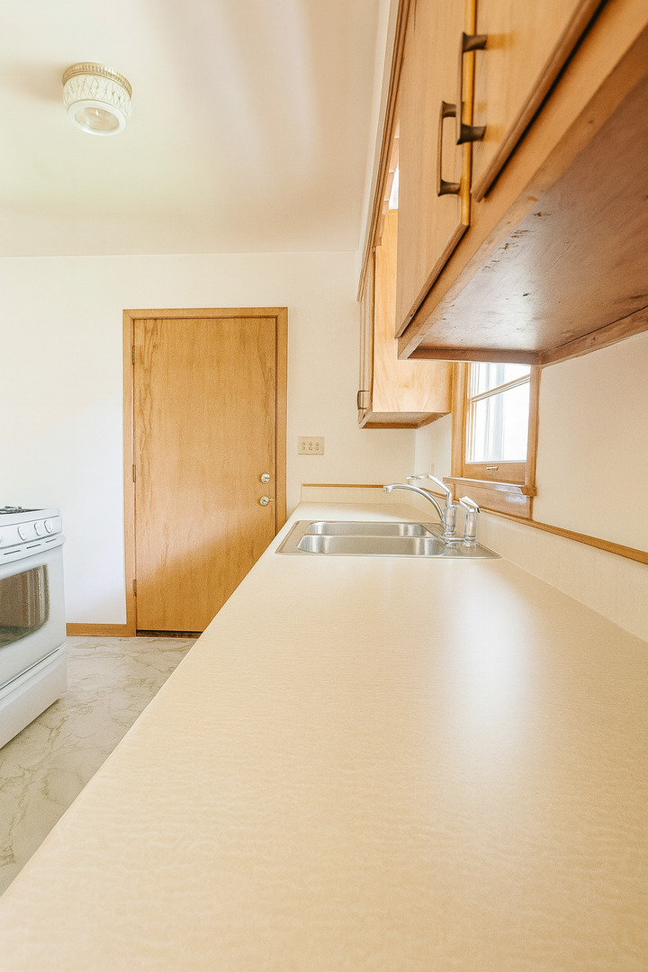1 Gary Court Normal, IL 61761 - Photo 13 of 29 a view of an empty room with a fireplace