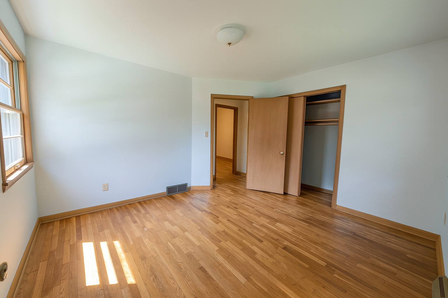 1 Gary Court Normal, IL 61761 - Photo 15 of 29 a view of an empty room with wooden floor and a window