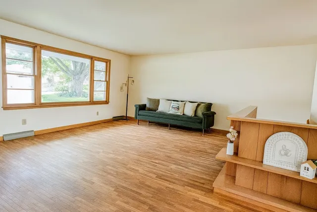 a kitchen with appliances a sink and cabinets