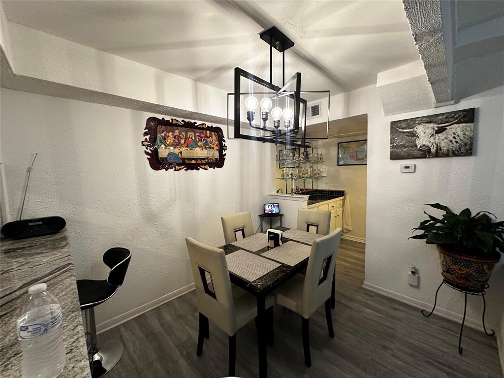 4272 Madera Road, Unit 4 Irving, TX 75038 - Photo 11 of 32 a view of a dining room with furniture and wooden floor