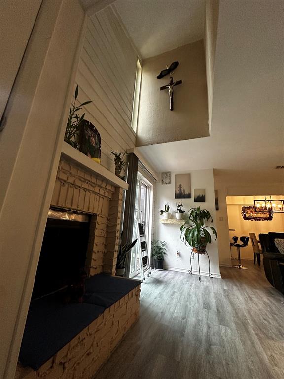 4272 Madera Road, Unit 4 Irving, TX 75038 - Photo 25 of 32 a living room with furniture and a fireplace