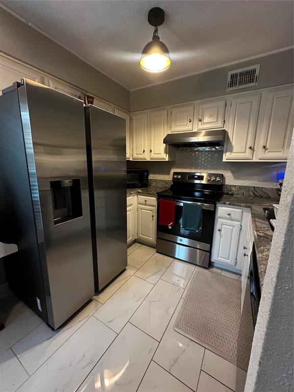 4272 Madera Road, Unit 4 Irving, TX 75038 - Photo 27 of 32 a kitchen with granite countertop a refrigerator and a stove