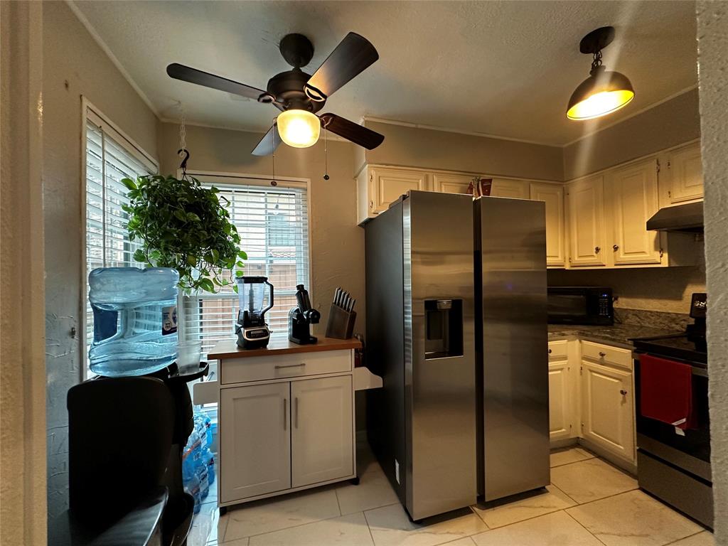 4272 Madera Road, Unit 4 Irving, TX 75038 - Photo 28 of 32 a kitchen with a refrigerator and a sink