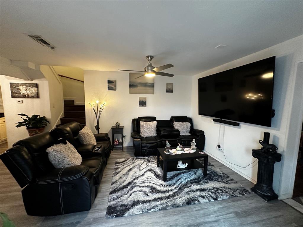 4272 Madera Road, Unit 4 Irving, TX 75038 - Photo 2 of 32 a living room with furniture and a flat screen tv