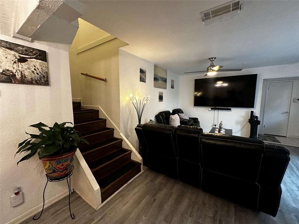 4272 Madera Road, Unit 4 Irving, TX 75038 - Photo 3 of 32 a living room with furniture and a flat screen tv