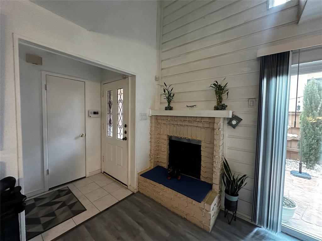 4272 Madera Road, Unit 4 Irving, TX 75038 - Photo 4 of 32 a living room with furniture and a fireplace