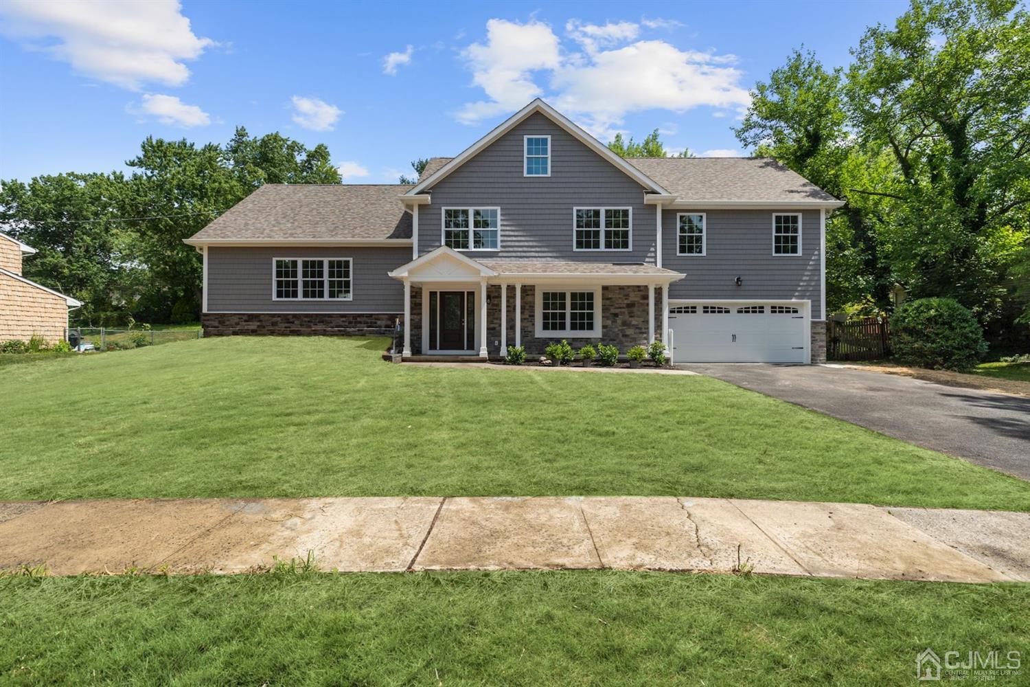 13 Perry Road East Brunswick, NJ 08816 - Photo 1 of 25 a front view of a house with a garden and yard