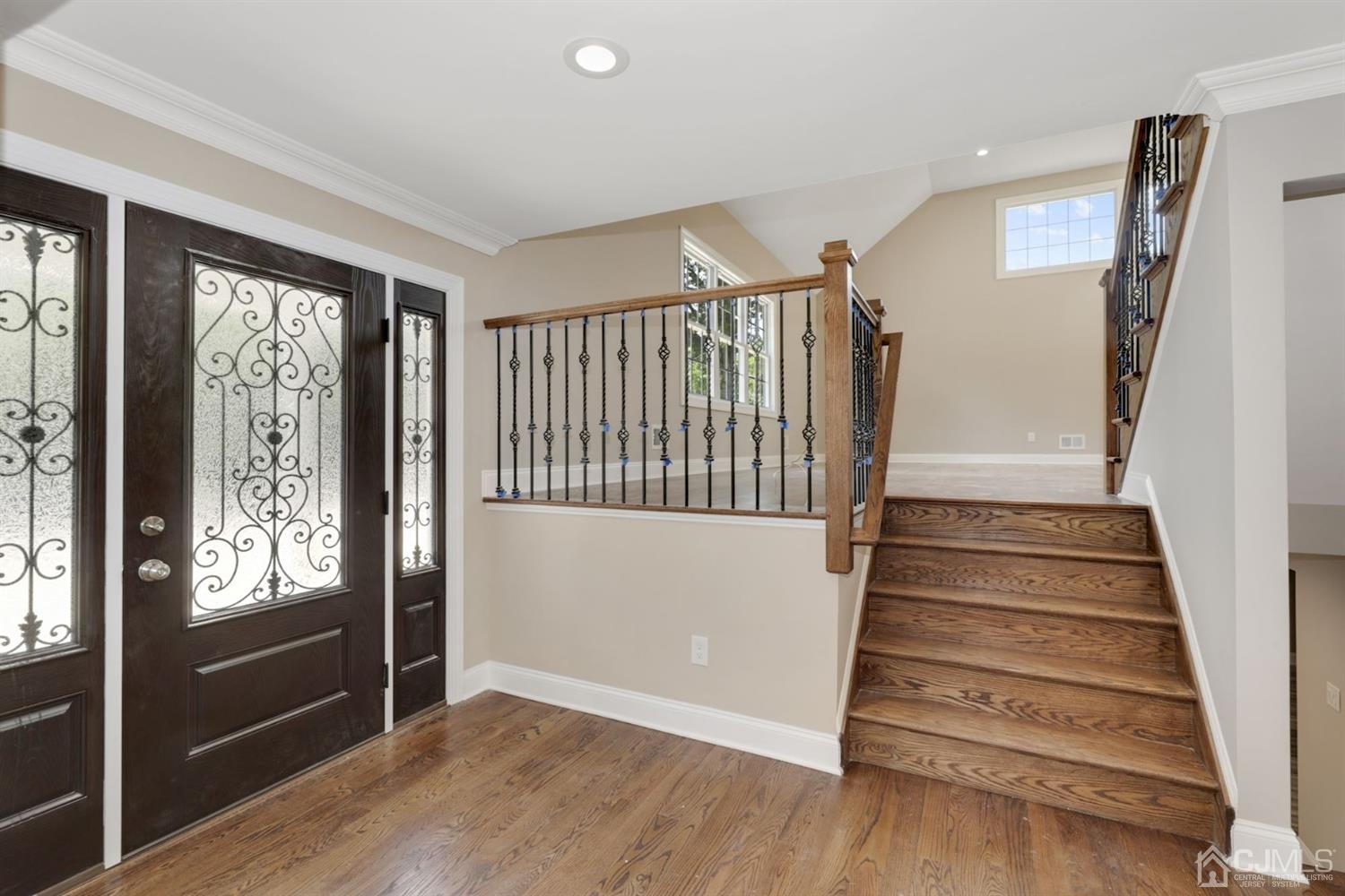 13 Perry Road East Brunswick, NJ 08816 - Photo 2 of 25 a view of entryway with stairs and wooden floor