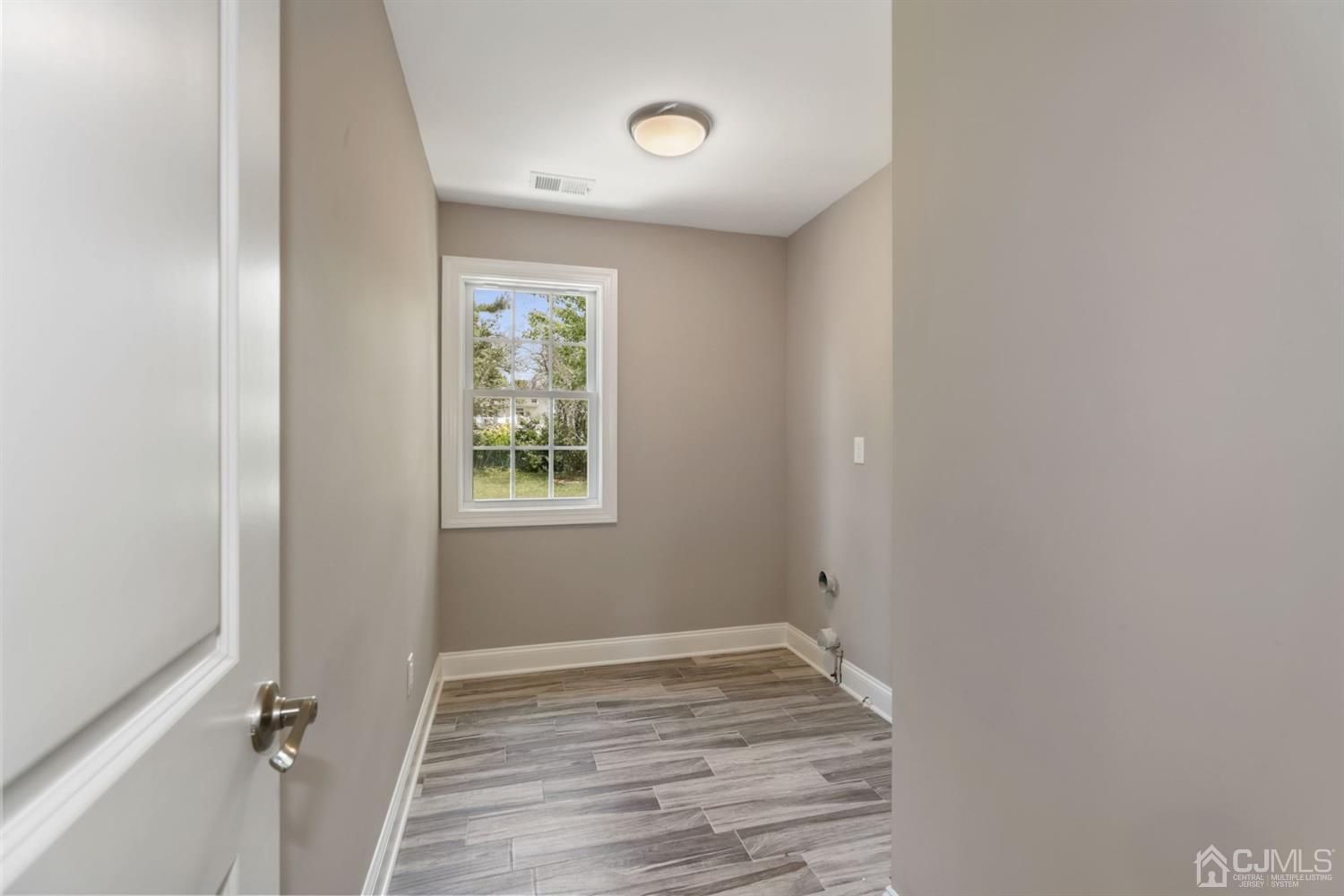 13 Perry Road East Brunswick, NJ 08816 - Photo 14 of 25 a view of room with hardwood floor and window