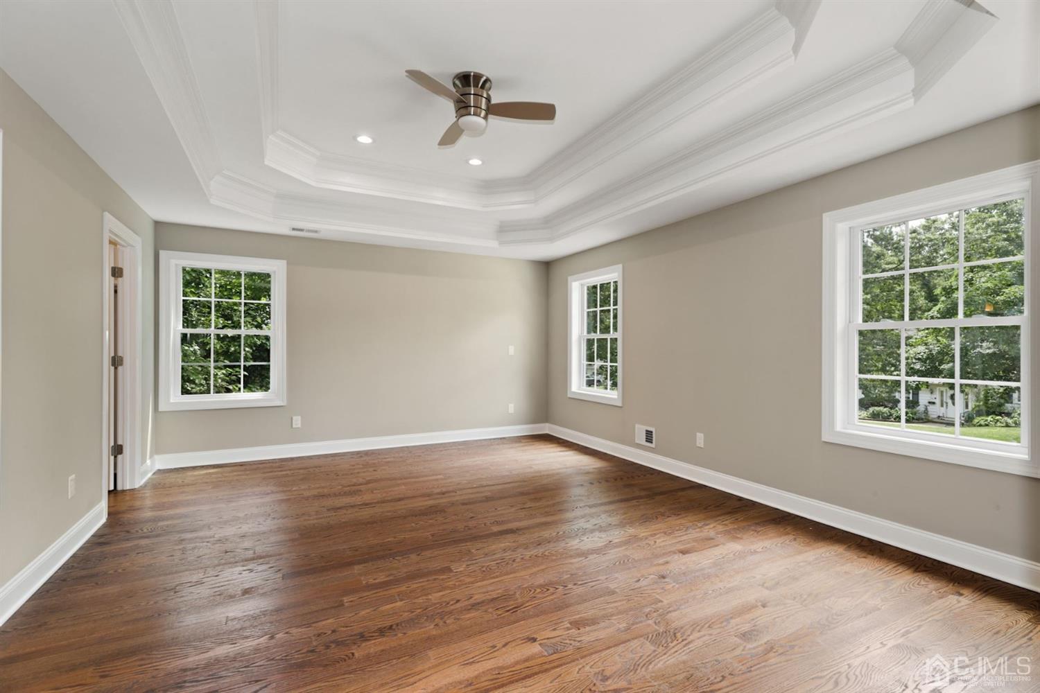 13 Perry Road East Brunswick, NJ 08816 - Photo 16 of 25 a view of an empty room with a window and wooden floor