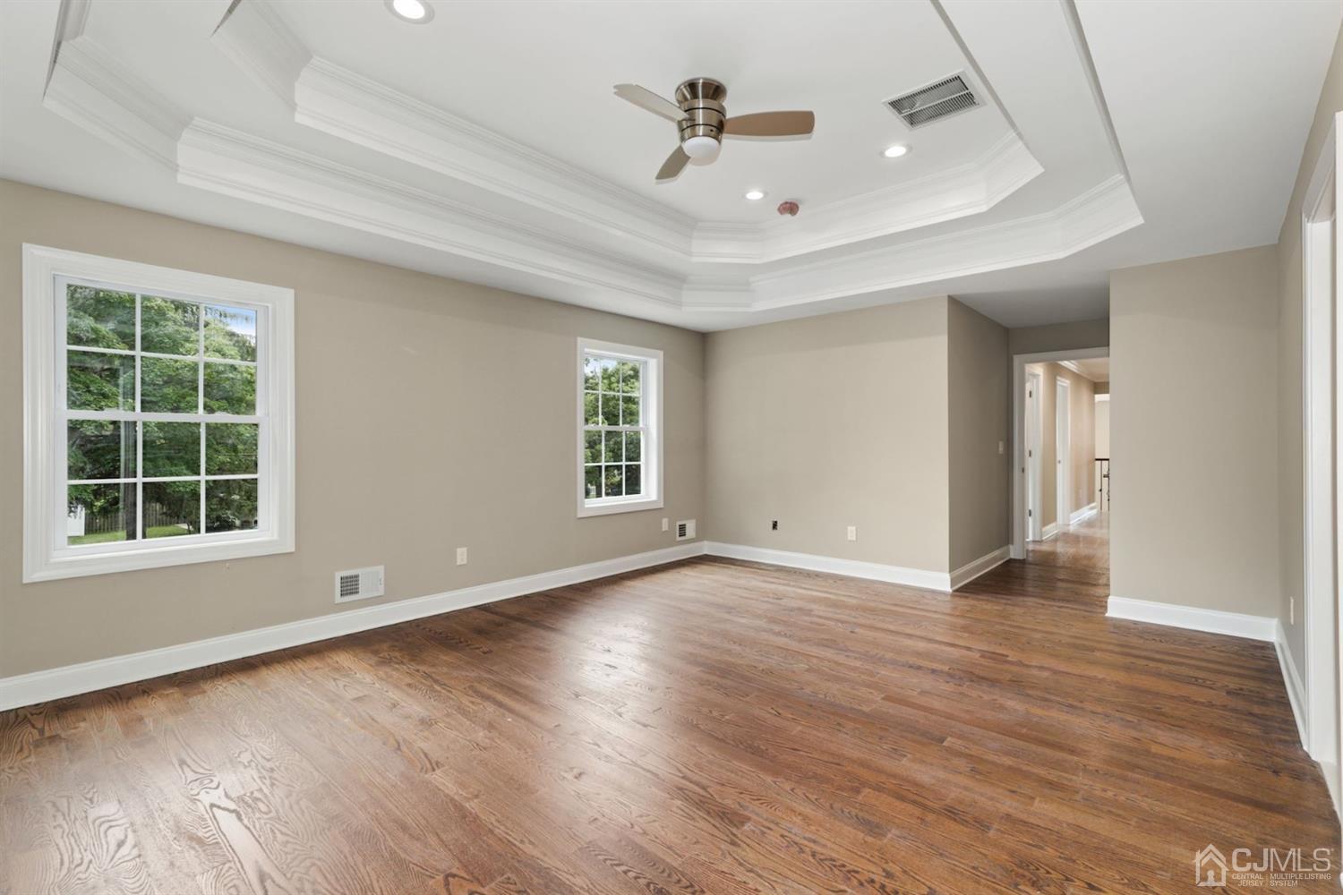 13 Perry Road East Brunswick, NJ 08816 - Photo 18 of 25 an empty room with wooden floor and windows