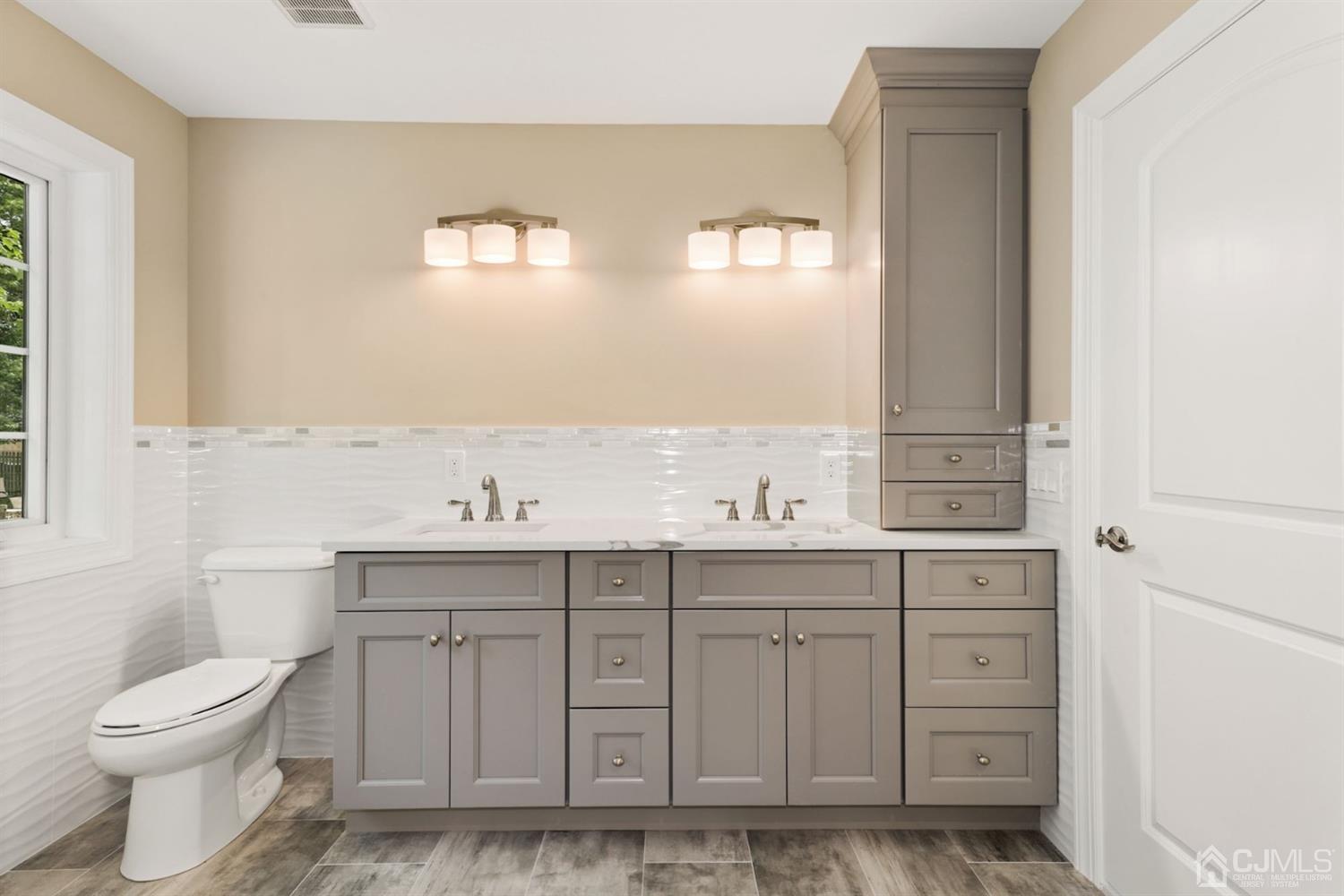 13 Perry Road East Brunswick, NJ 08816 - Photo 21 of 25 a bathroom with a sink a toilet and a mirror