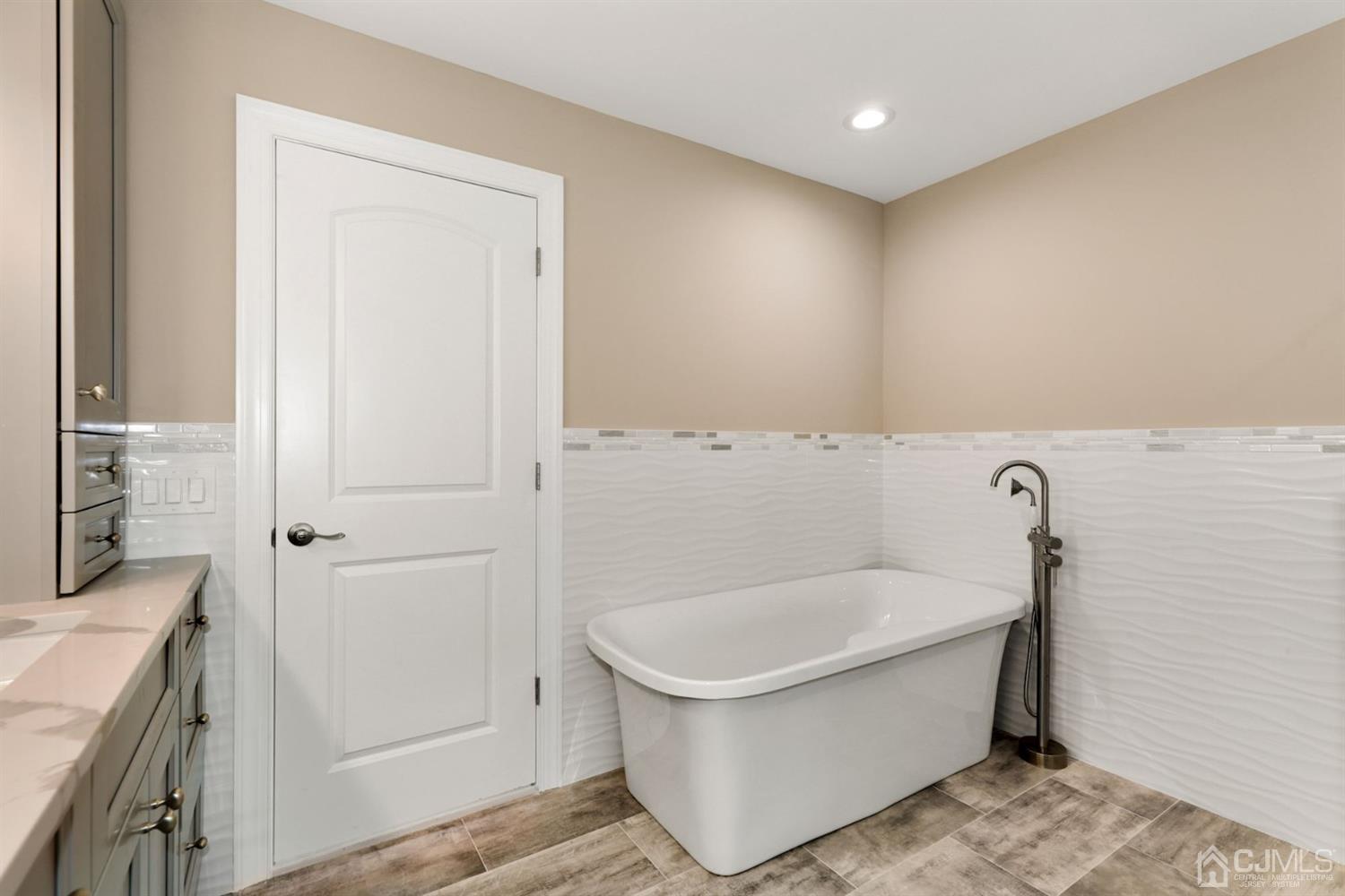 13 Perry Road East Brunswick, NJ 08816 - Photo 22 of 25 a bathroom with a bathtub and a sink