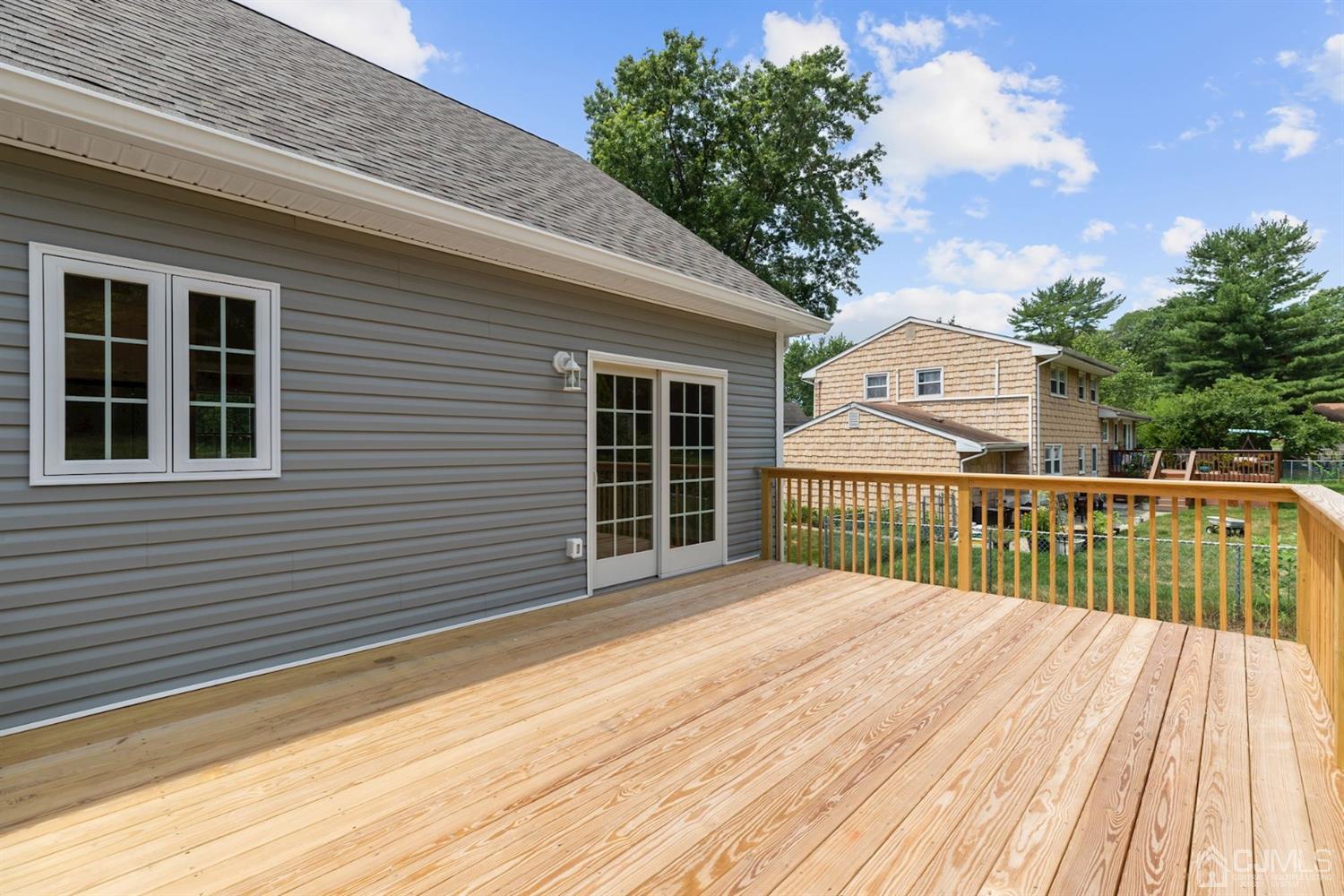 13 Perry Road East Brunswick, NJ 08816 - Photo 24 of 25 a view of a balcony with wooden floor and fence