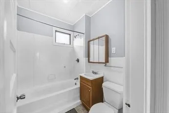 a bathroom with a toilet sink and bathtub