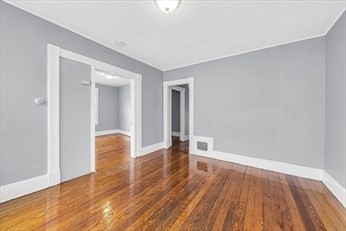 71 Knox Street, Unit 2 Springfield, MA 01105 - Photo 3 of 14 a view of empty room with wooden floor
