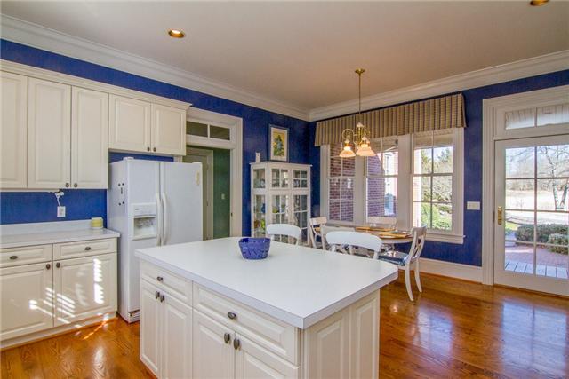 4881 Campbell Road Cross Plains, TN 37049 - Photo 5 of 19 a kitchen with a refrigerator a stove and a wooden floors