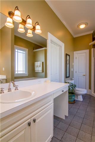 4881 Campbell Road Cross Plains, TN 37049 - Photo 7 of 19 a bathroom with a sink a vanity and a mirror