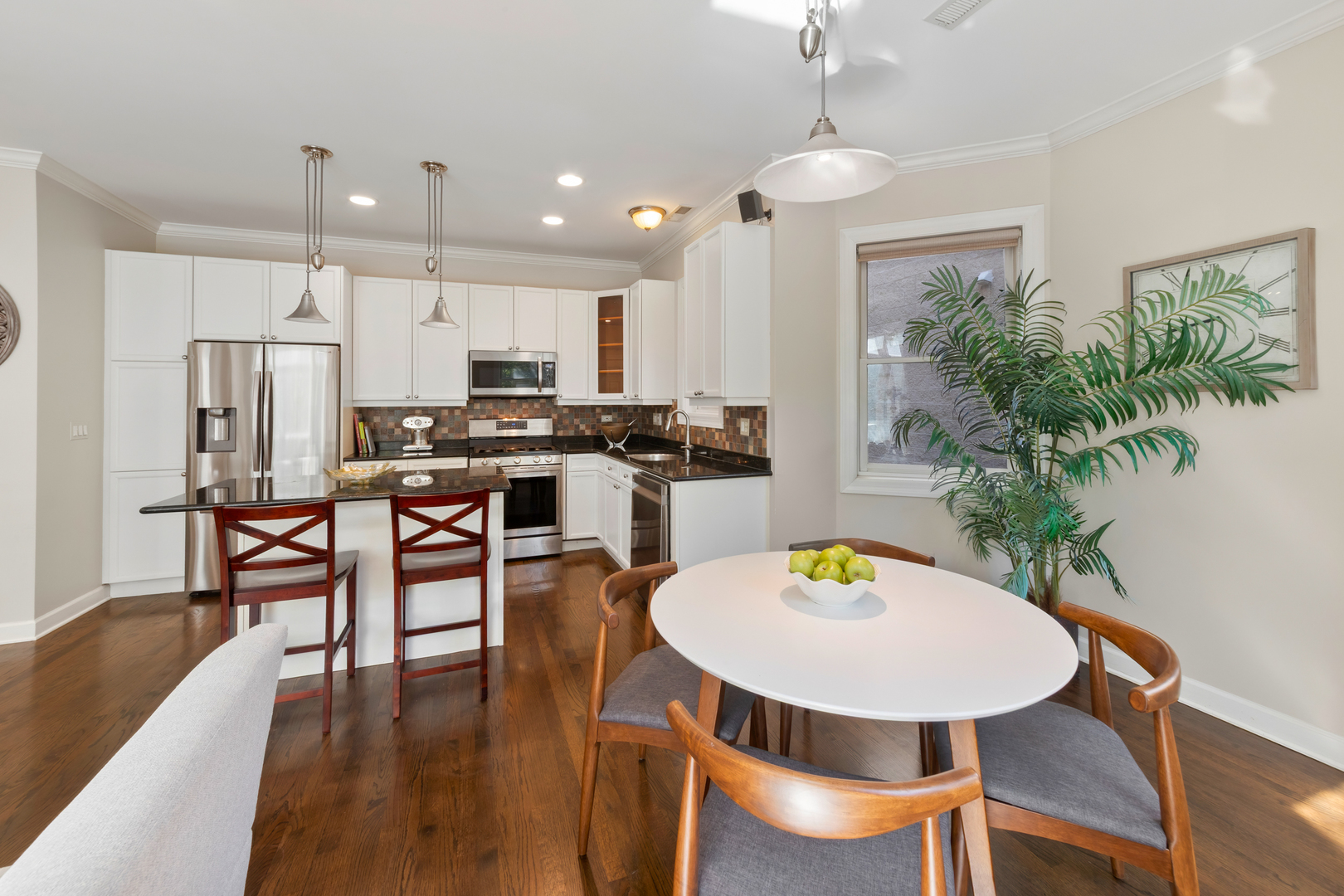 3438 North Ashland Avenue, Unit 2N Chicago, IL 60657 - Photo 5 of 22 a view of a dining room with furniture and wooden floor