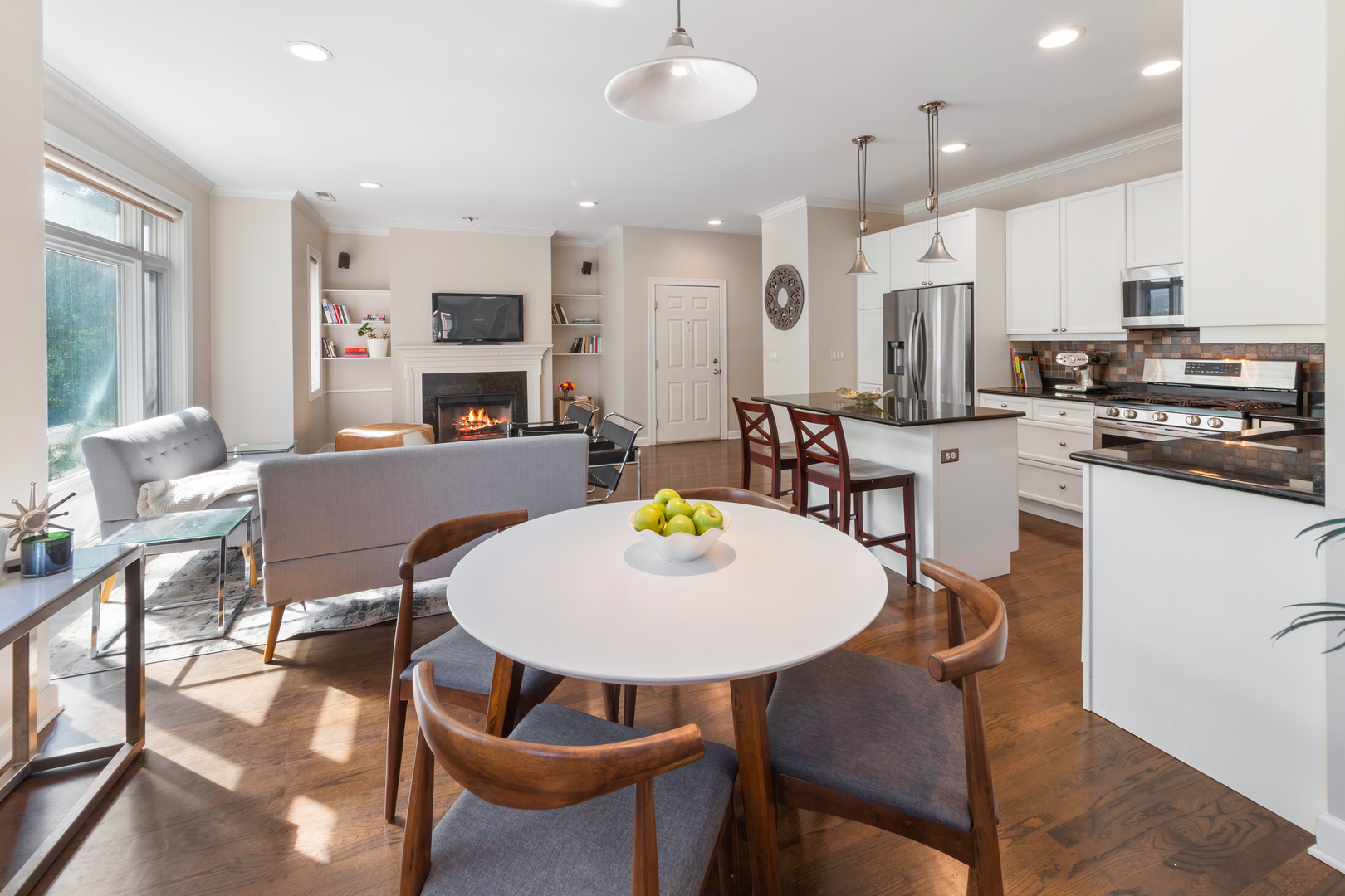 3438 North Ashland Avenue, Unit 2N Chicago, IL 60657 - Photo 8 of 22 a dining room with stainless steel appliances kitchen island granite countertop a dining table chairs and a refrigerator