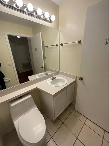 a bathroom with a sink vanity and a mirror