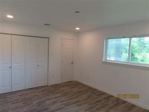403 High Ridge Street Houston, TX 77013 - Photo 10 of 13 a view of an empty room with wooden floor and window