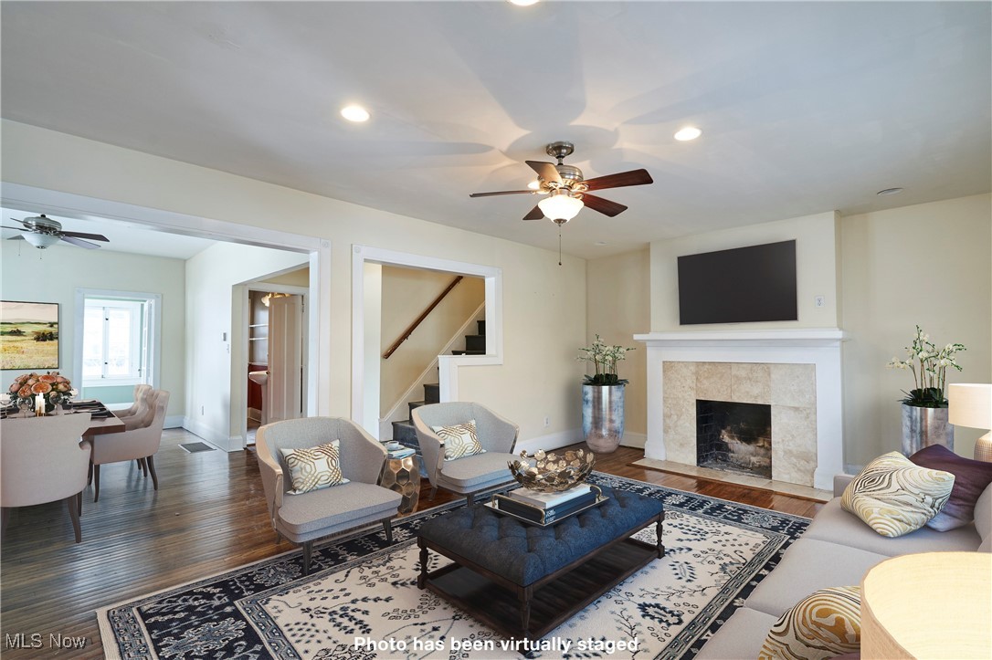 2152 Middlefield Road Cleveland, OH 44106 - Photo 3 of 50 Living room featuring hardwood / wood-style flooring, a tile fireplace, and ceiling fan