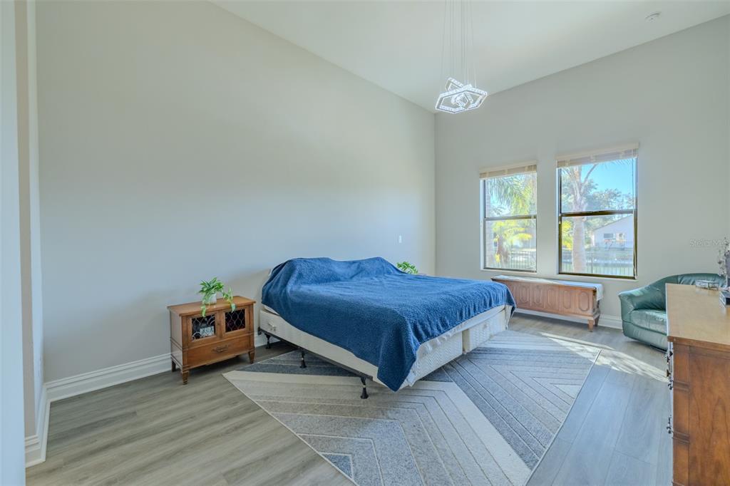 4950 Diamonds Palm Loop Wesley Chapel, FL 33543 - Photo 19 of 65 a bedroom with a bed and a window