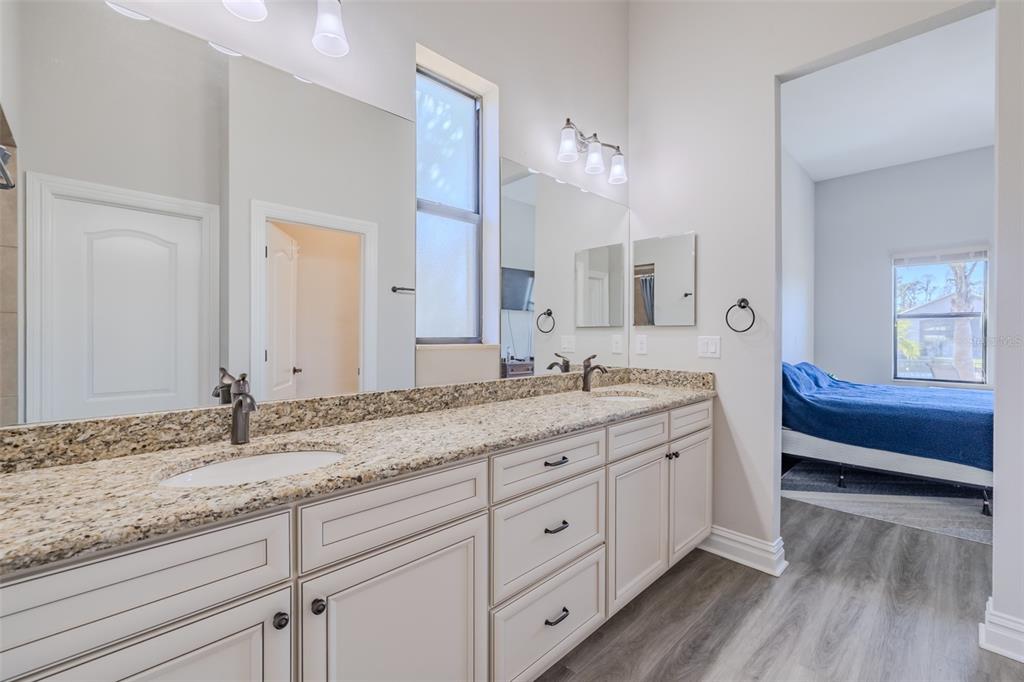 4950 Diamonds Palm Loop Wesley Chapel, FL 33543 - Photo 23 of 65 a bathroom with double vanity and a mirror
