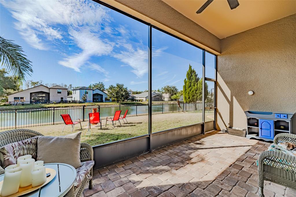 4950 Diamonds Palm Loop Wesley Chapel, FL 33543 - Photo 34 of 65 a living room with couch and a table