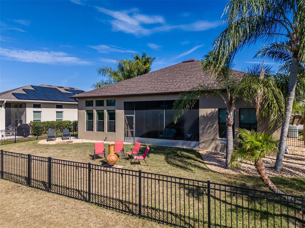 4950 Diamonds Palm Loop Wesley Chapel, FL 33543 - Photo 36 of 65 a front view of a house with a porch