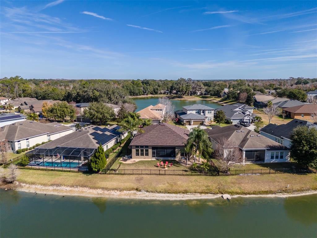 4950 Diamonds Palm Loop Wesley Chapel, FL 33543 - Photo 42 of 65 an aerial view of residential houses with outdoor space and ocean view