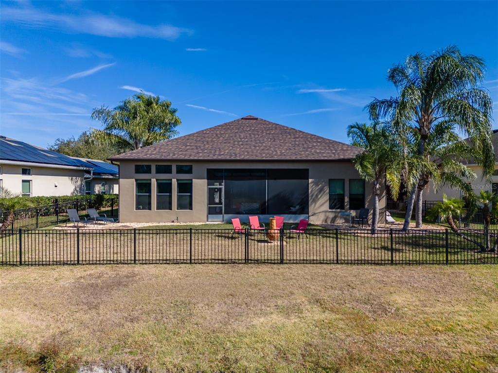 4950 Diamonds Palm Loop Wesley Chapel, FL 33543 - Photo 44 of 65 a view of a house with a swimming pool