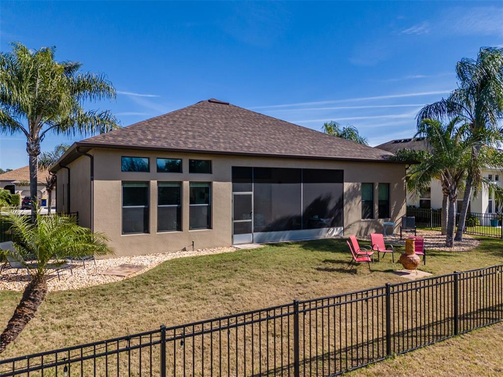 4950 Diamonds Palm Loop Wesley Chapel, FL 33543 - Photo 45 of 65 a view of a house with sitting area and garden