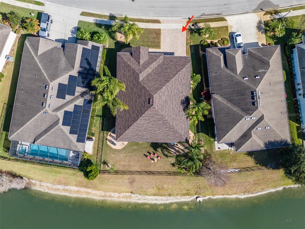 4950 Diamonds Palm Loop Wesley Chapel, FL 33543 - Photo 49 of 65 an aerial view of house with yard swimming pool and outdoor seating