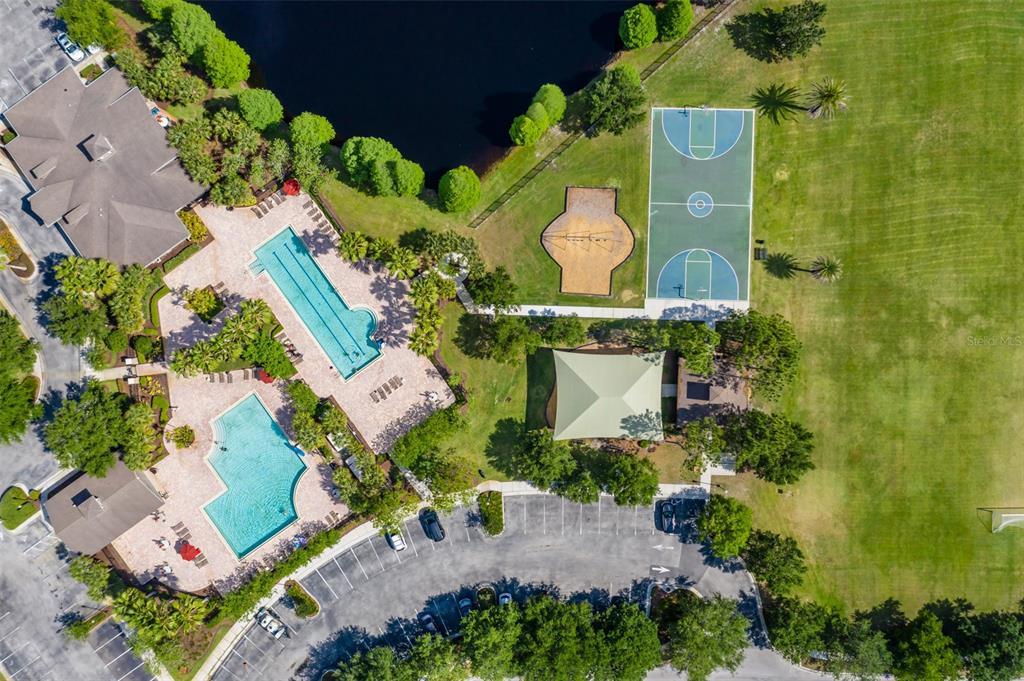 4950 Diamonds Palm Loop Wesley Chapel, FL 33543 - Photo 63 of 65 an aerial view of a house with a garden and swimming pool