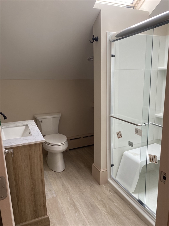 374 Main Street, Unit 2 Gloucester, MA 01930 - Photo 2 of 12 a white toilet sitting next to a bathroom sink
