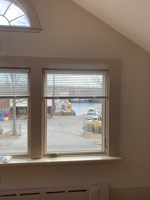 374 Main Street, Unit 2 Gloucester, MA 01930 - Photo 8 of 12 a window that has a lot of items on it