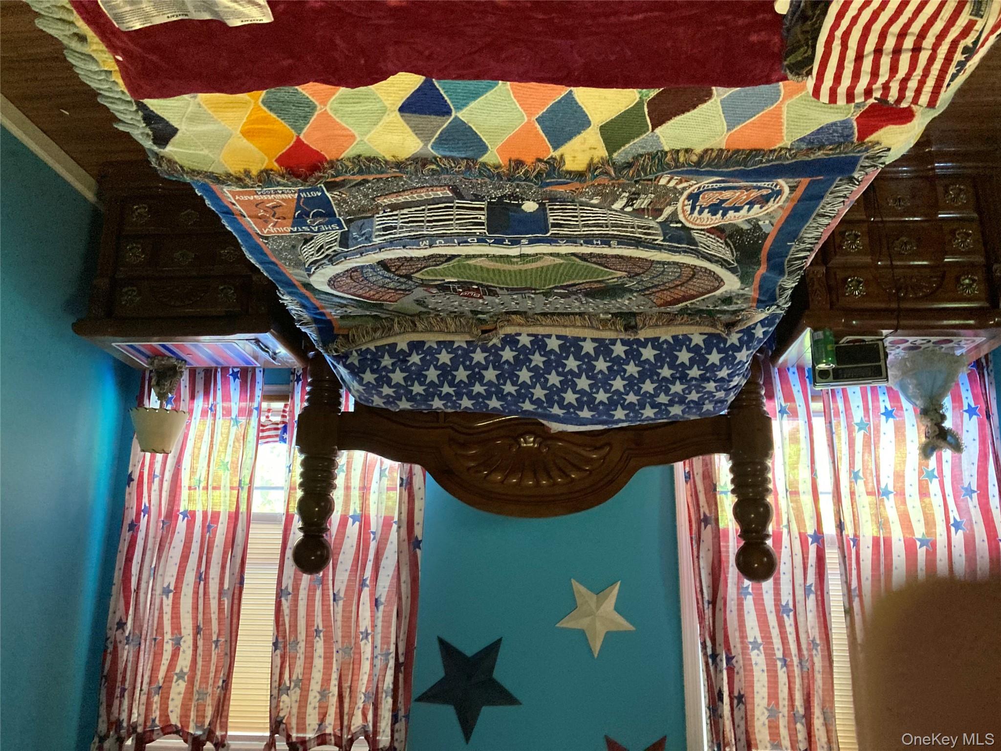 699 Budd Road Woodbourne, NY 12788 - Photo 4 of 11 a bed sitting in a bedroom next to a window