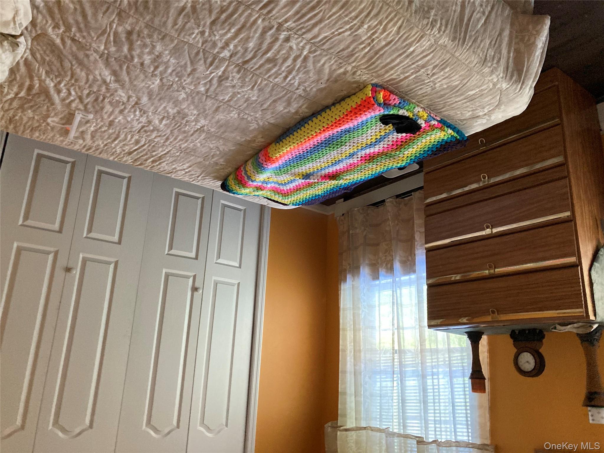 699 Budd Road Woodbourne, NY 12788 - Photo 5 of 11 a bedroom with a bed and a window