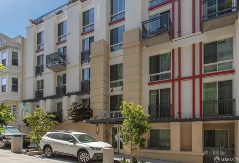 a view of cars parked in front of a building