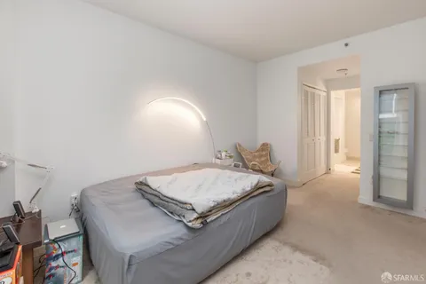 a living room with a bed and a table