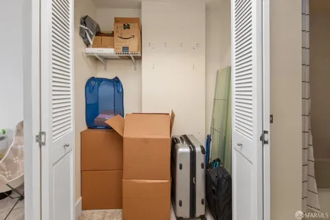 a blue refrigerator freezer and a wooden floor