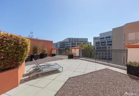 a view of a balcony with sink and outdoor view