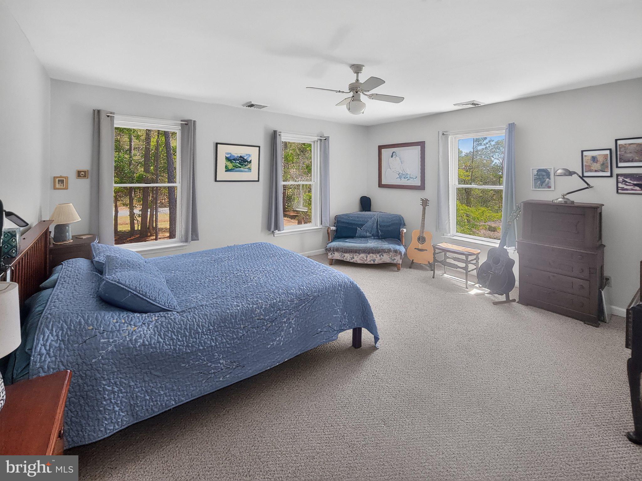5214 David Greene Road Cambridge, MD 21613 - Photo 21 of 73 Serene bedroom with nature views.
